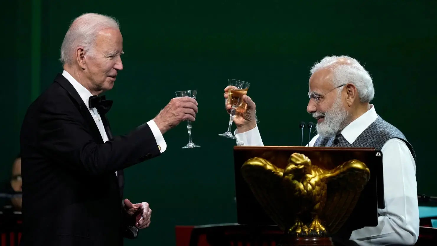 Joe Biden and Narendra Modi making a toast, seen by many as a show of unity between two controversial leaders.
