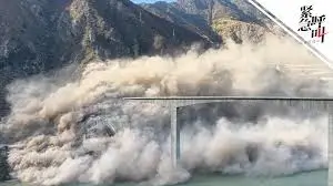 Hongqi Bridge collapse in Maerkang Sichuan China during landslides sending dust and debris into the valley