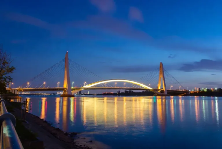 Representational night view of Hongqi Bridge in Sichuan China reflecting on river water