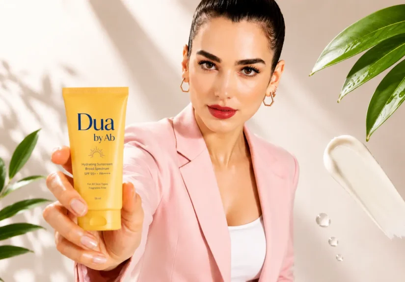 Dua Lipa promoting Dua by AB hydrating sunscreen skincare cream in a premium beauty campaign with natural glow makeup and soft aesthetic background