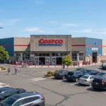 Is Costco open on July 4, 2026 exterior view of a Costco Wholesale warehouse with customers and parked cars